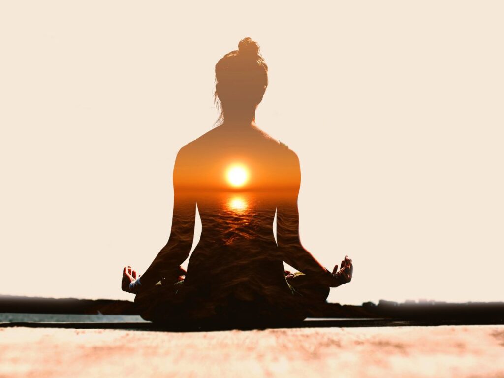 Morning yoga session by the banks of the holy Ganga River in Rishikesh, The feeling of spiritual connectivity - Yoga Day 2023