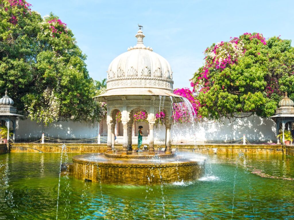 Lush green Saheliyon-Ki-Bari garden with decorative fountains and marble structures