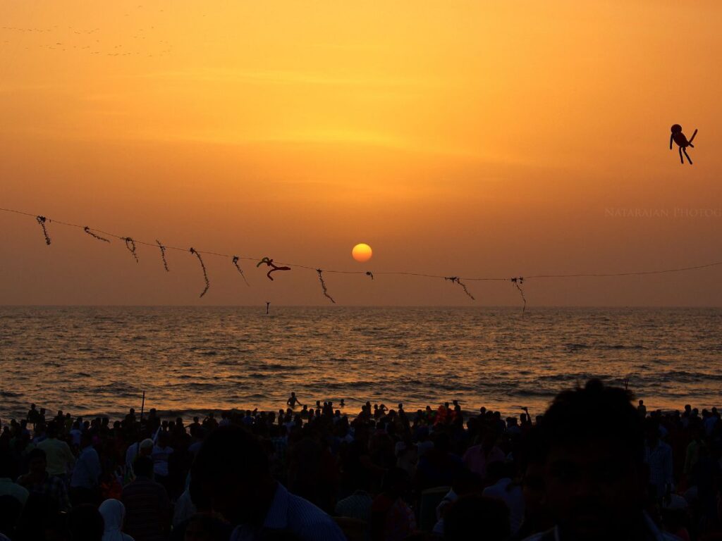 sun is setting and people enjoying on Juhu beach