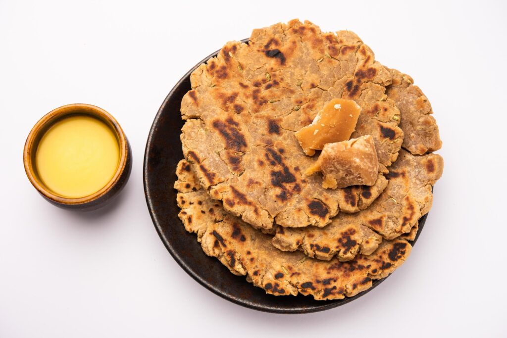 sweet-roti-made-out-of-rice-flour-jaggery-and-ghee-gud-ki-roti-gur-ki-roti-jaggery-bhakri-meethi-gud-ki-roti-winter-food-copy-space-free-photo