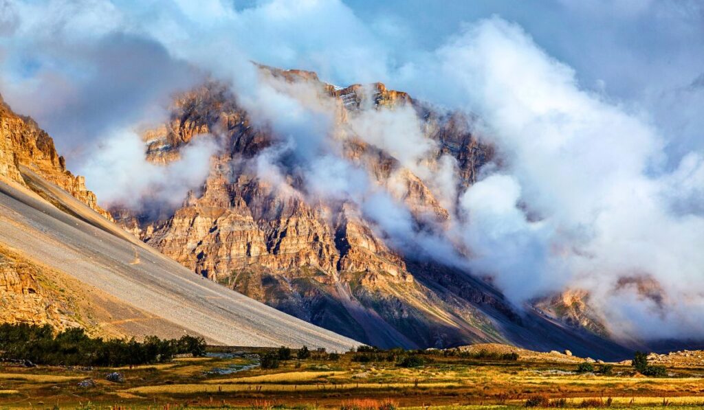 clouds covering mountains in spiti valley