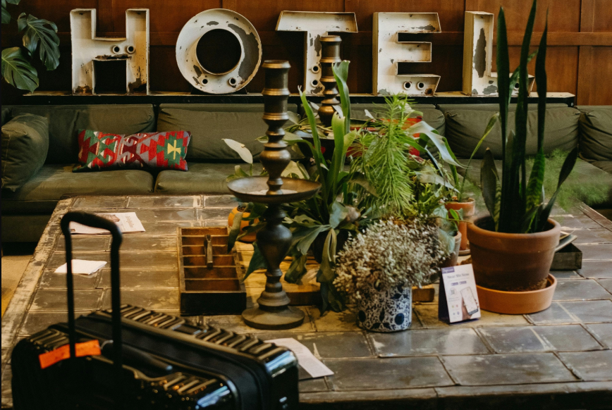 hotel check-in time: a black suitcase  at a hotel's reception