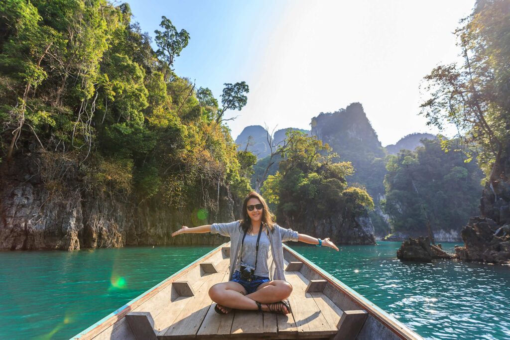 top-10-visa-free-countries-for-Indian: A woman on a boat in waters 