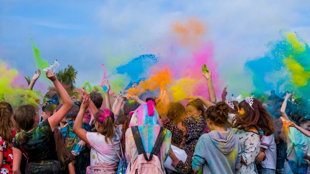 people covered in Colorful powder on Holi Celebration